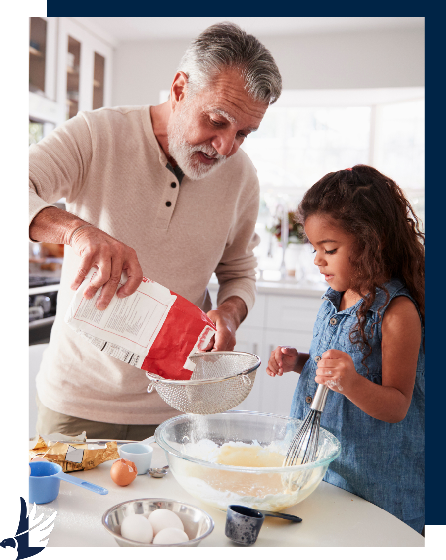 Grandfather baking with granddaughter